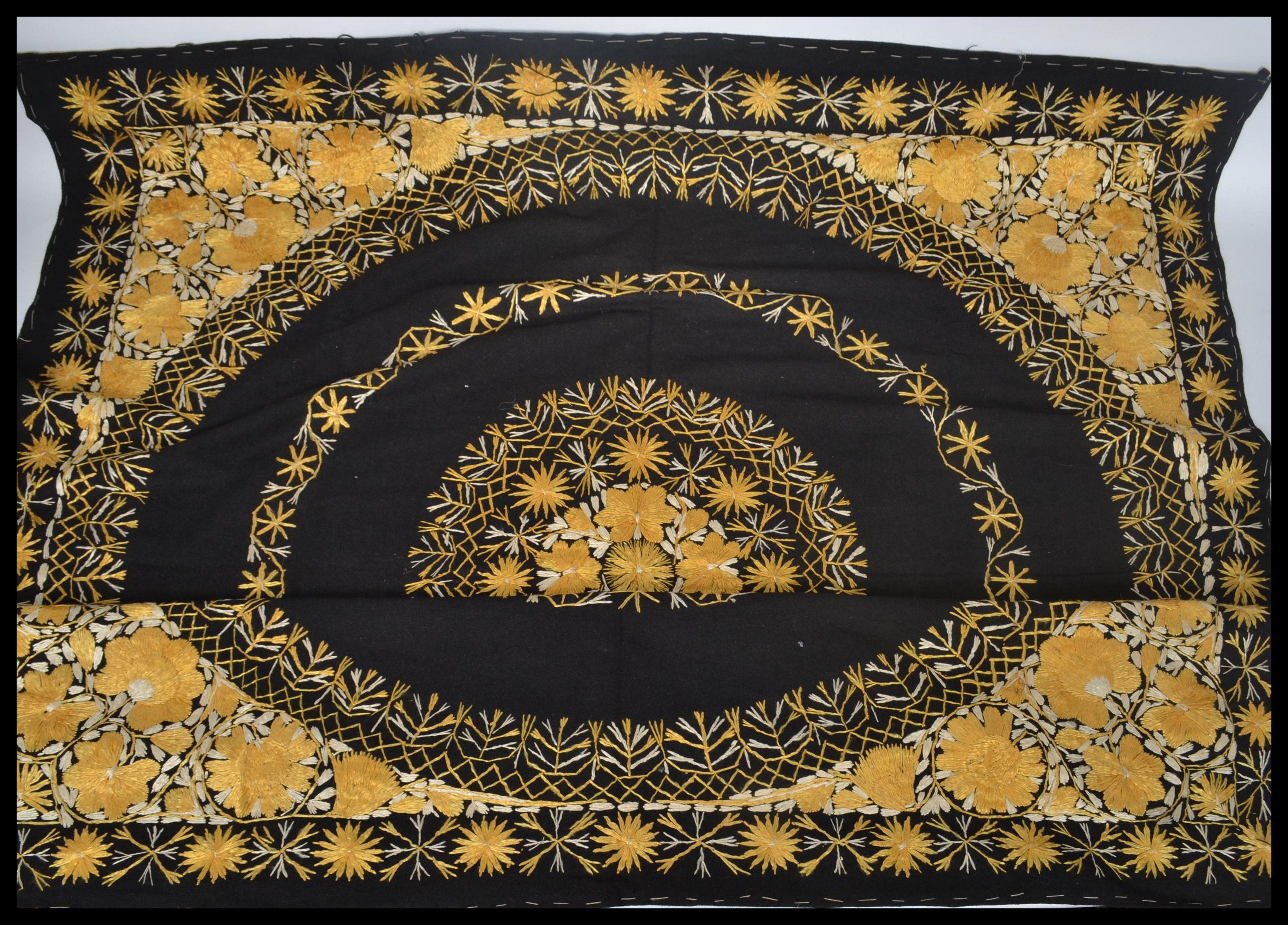 An early 20th century Indian wall hanging having a cotton back with silk threads. The design of