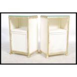 A pair of mid 20th century bedside cabinets believed to be by Lloyd Loom, open recess above cupboard