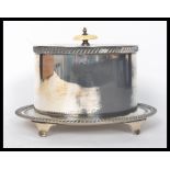 A stunning silver plated bacon warmer bearing marks for Walker and Hall to the base, raised on