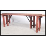 A pair of vintage 20th century Industrial heavy planked wooden folding benches - school - factory.