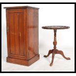 An Edwardian walnut pot cupboard / bedside cabinet raised on a square plinth base with slatted