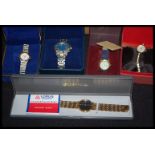 A group of five boxed watches to include Lorus, Oleg, Cassini, Solo, and Krug-Baumen boxed