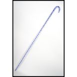 A vintage 20th century Nailsea glass studio art walking stick cane having a spiral twist design with