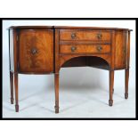 A 20th century Regency revival  mahogany sideboard, serpentine front, two drawers over arch