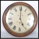 A 19th century Victorian oak cased wall mounted station / school  clock having a white enamel face