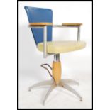 A retro sputnik atomic 1970's barbers chair in the manner of Viko Baumritter . The chair having a