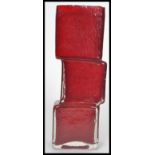 A vintage 20th century Whitefriars style studio glass  red drunken bricklayer vase in the manner