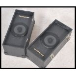 A pair of portable twin speakers by Portogram Magnat DJ speakers in carry cases having carry