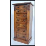 A 19th century Victorian mahogany and rosewood fronted Wellington chest of drawers. Of pedestal form