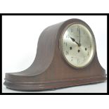 An early 20th century oak cased mantle clock of generous proportions with retail stamp for Pleasance