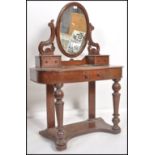 A Victorian mahogany duchess dressing table raised on turned supports with serpentine shaped