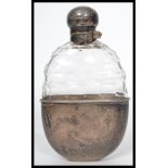 A stunning 19th century Victorian silver hallmarked and cut glass hip flask with silver hinged bun