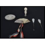 A group of hallmarked silver and mother of pearl items to include picks, brooch etc. Please see