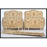 A pair of vintage 20th century French Single Corbeille beds having shabby chic painted head and