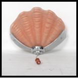 A mid 20th century Art Deco Odeon style frosted glass shell  shaped porch wall light lamp being