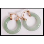 A pair of hallmarked Jade and 9ct gold hoop earrings, the gold mounts marked with makers marks for