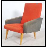 A 1960's french easy / lounge chair / armchair being of angular form upholstered in a two tone