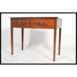 A 19th century bow fronted mahogany writing table desk being raised on square tapering legs united