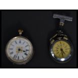 Two vintage early 20th century watches. One being a silver continental pocket watch and the other