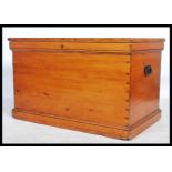 A good 19th century pine cabinet makers trunk - chest. Pine panelled body with hinged top opening to