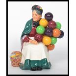 A vintage 20th century Royal Doulton ' The Old Balloon Seller ' HN1315 ceramic figurine, 20cm high