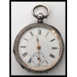 An early 20th century continental silver pocket watch. The white enamel dial having a Roman