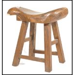 A Chinese elm wood fish stool. Raised on squared l