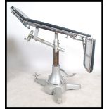 A vintage 20th century Industrial / medical dentists chair / surgeons theatre bed of enamel