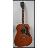 A vintage Eko made 12 string acoustic guitar. The headstock with Eko plastic trim, and matching