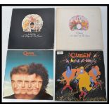 Queen Vinyl Records - A group of four Long play LP vinyl records by Queen to include A Night At