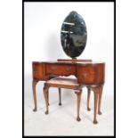 A mid century Queen Anne Revival mahogany kidney shaped dressing table, central drawer flanked by