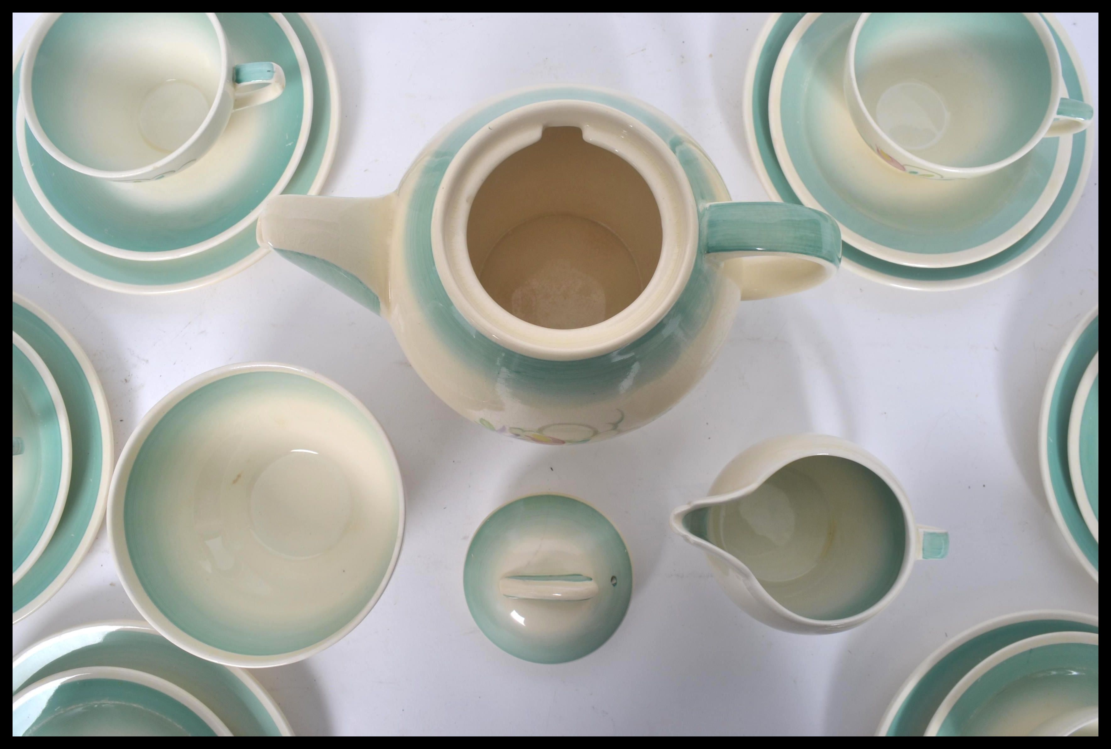 A 1930's Susie Cooper Dresden Spray six person tea service set consisting of six cups saucers and - Image 5 of 6