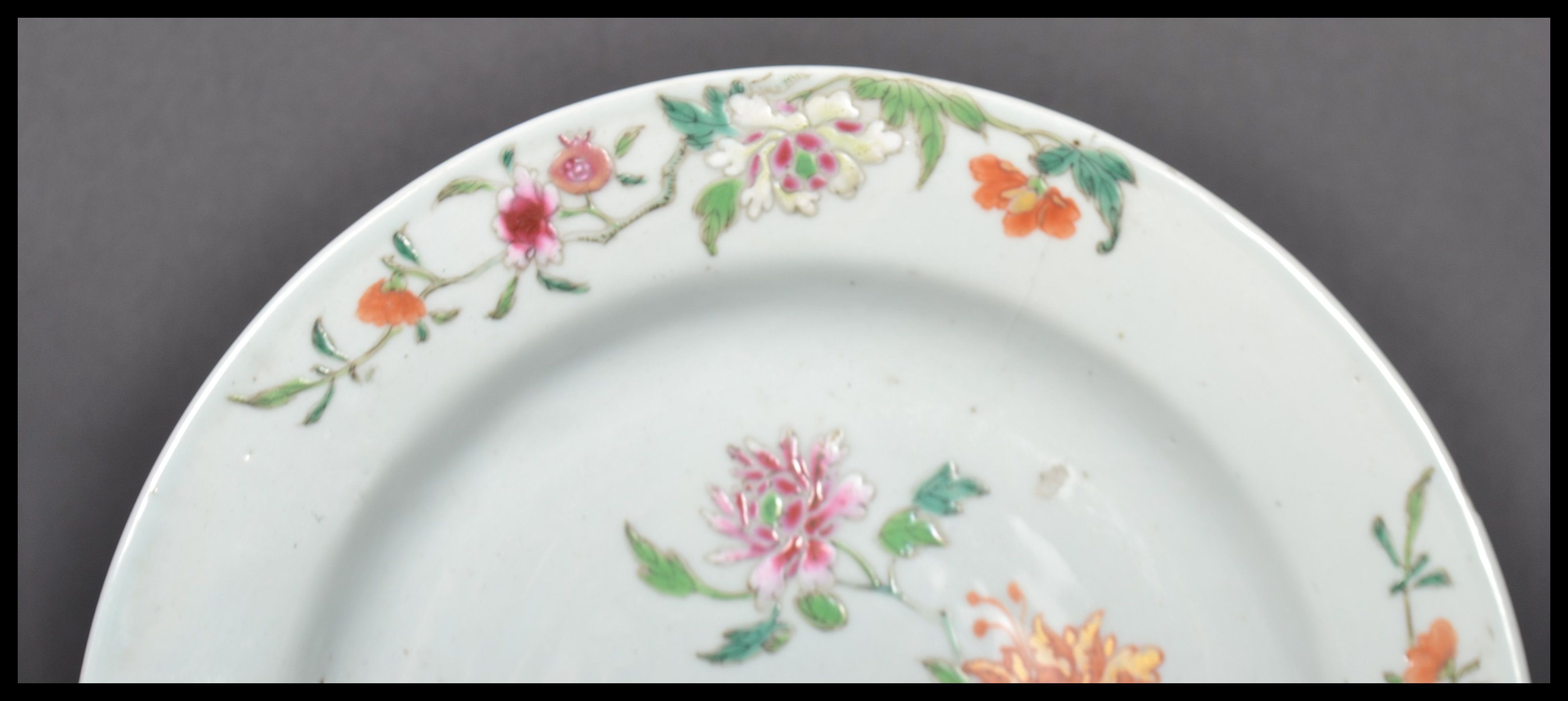 An 18th century Chinese Qing Long Famille Rose plate hand painted with enamels depicting floral - Image 3 of 8