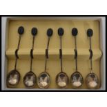 A set of six cased silver hallmarked coffee bean coffee spoons, Sheffield assay marks, possibly by