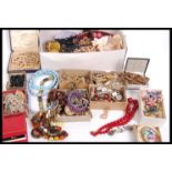 A large box of vintage costume jewellery including silver, old pearl necklaces one with clasp marked