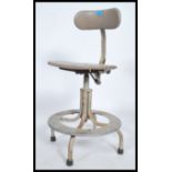 A retro 20th century medical / Industrial swivel office chair having chrome tubular frame with