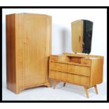 A retro 20th century double wardrobe and dressing table bedroom suite by Avalon.