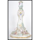 A 19th century Meissen ceramic table lamp of scrolled form hand painted with floral sprays and