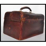 A 19th century Victorian leather doctors Gladstone type case, the double opening top with brass