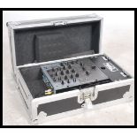 A Numark DM2050 Professional 3 Channel DJ mixer with leads together with a good aluminium cased