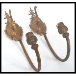 A pair of 19th century gilt brass wall lights sconces in the style of Adam. The arms of scrolled