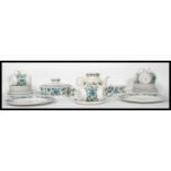A 20thj century retro part dinner and tea service by Midwinter consisting of teapot, cups, plates,
