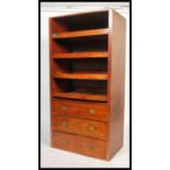 A 19th century linen press and chest of drawers combination having a set of linen slides raised over