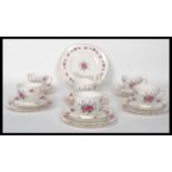 A vintage mid 20th century bone China tea service by Queen Anne, consisting of cups, saucers,