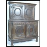 A 19th century Jacobean revival oak carved oak dresser. Raised on stile legs having twin carved