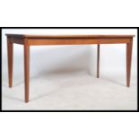 A 1960's retro teak wood Danish revival extending dining table of rectangular form being cross