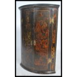 An 18th century Georgian Chinoiserie lacquered bow fronted  hanging wall cupboard having hand