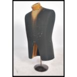 A vintage 20th century shop dummy - mannequin. The haberdashery torso finshed with black fabric on