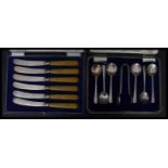 A silver hallmarked cased set of six silver teaspoons and unassociated  plated sugar tongs, London