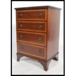 A Georgian style regency revival bachelors mahogany chest of drawers of smaller proportions having